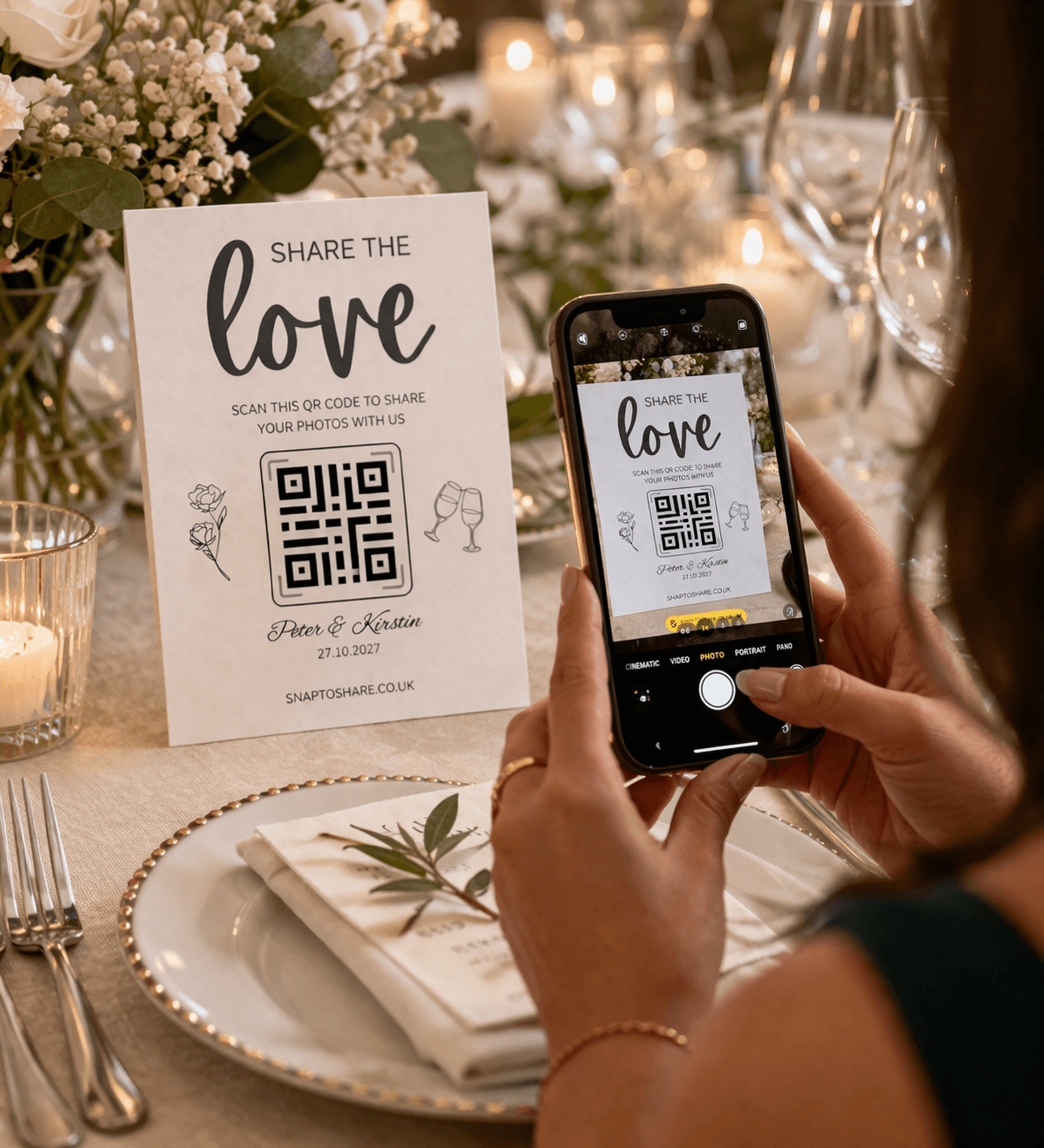 Guest scanning a Snap to Share QR code table card at a wedding
