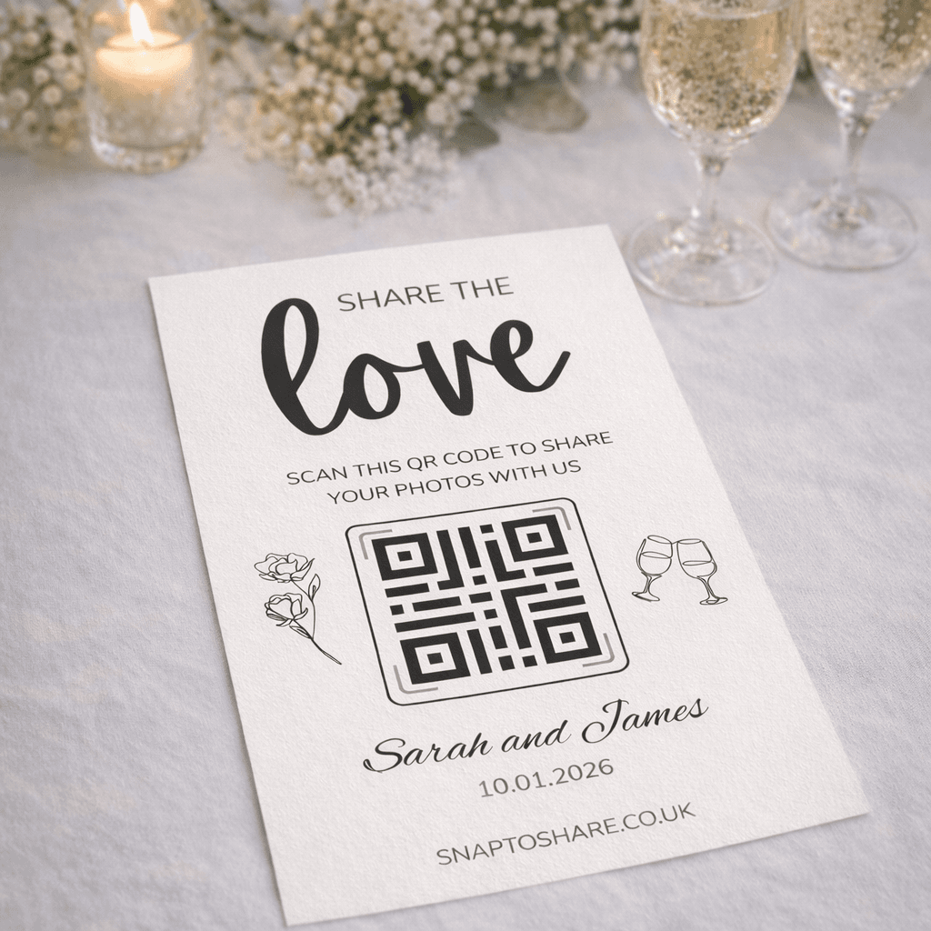 Printed Snap to Share table card with QR code beside champagne glasses